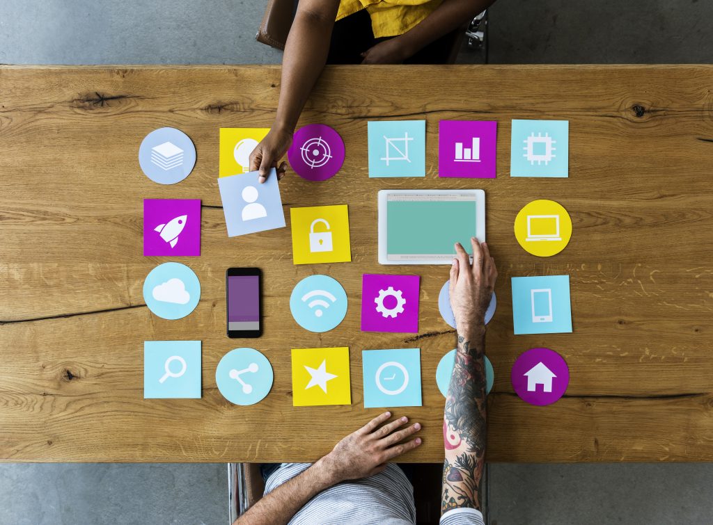 app icons with tablet computer on wooden table 2026 03 18 09 35 37 utc
